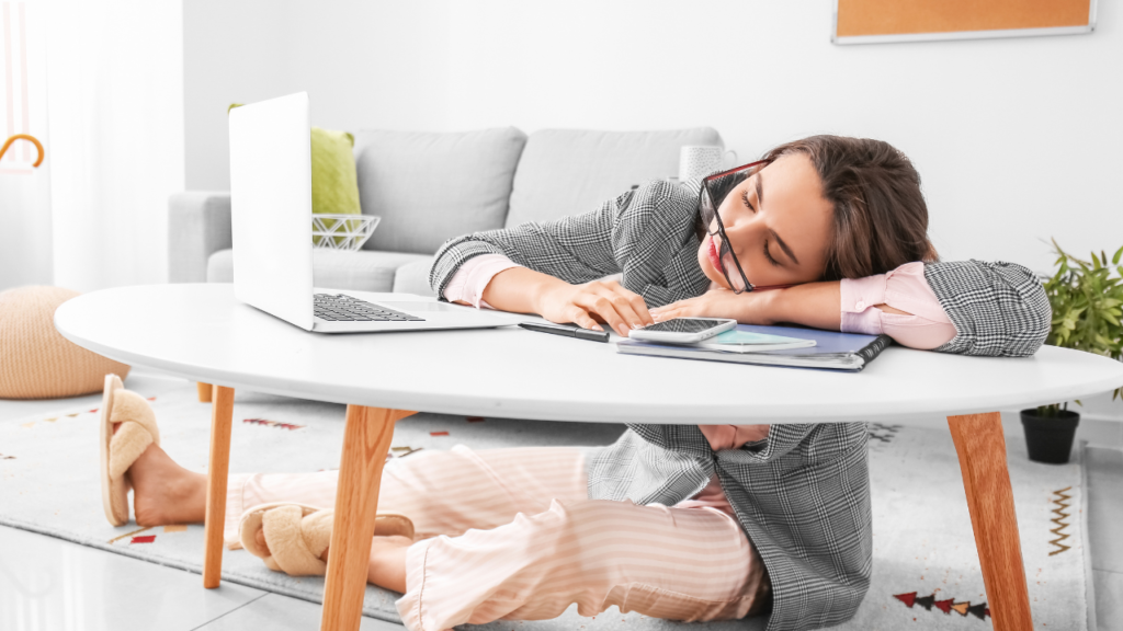 Working woman falling asleep while on her laptop due to poor sleep